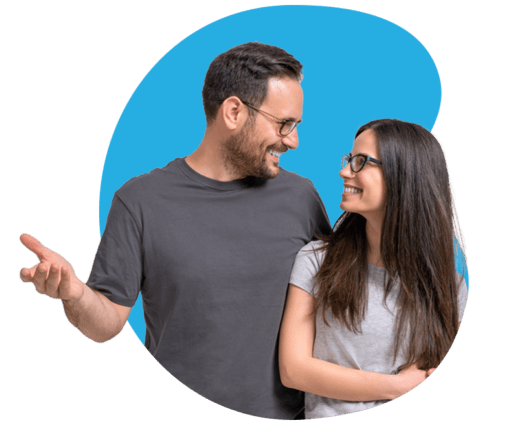 a young couple smile to indicate investor happiness