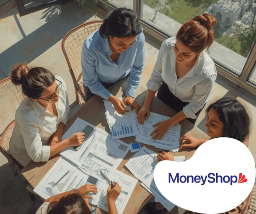 Group collaborating over financial documents.