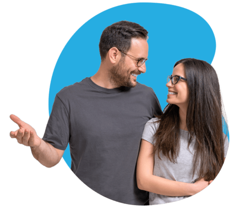 a young couple smile to indicate investor happiness