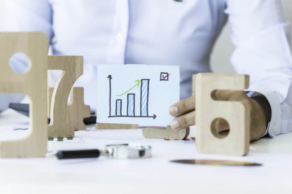 A graph hand drawn on paper to illustrate investment figures