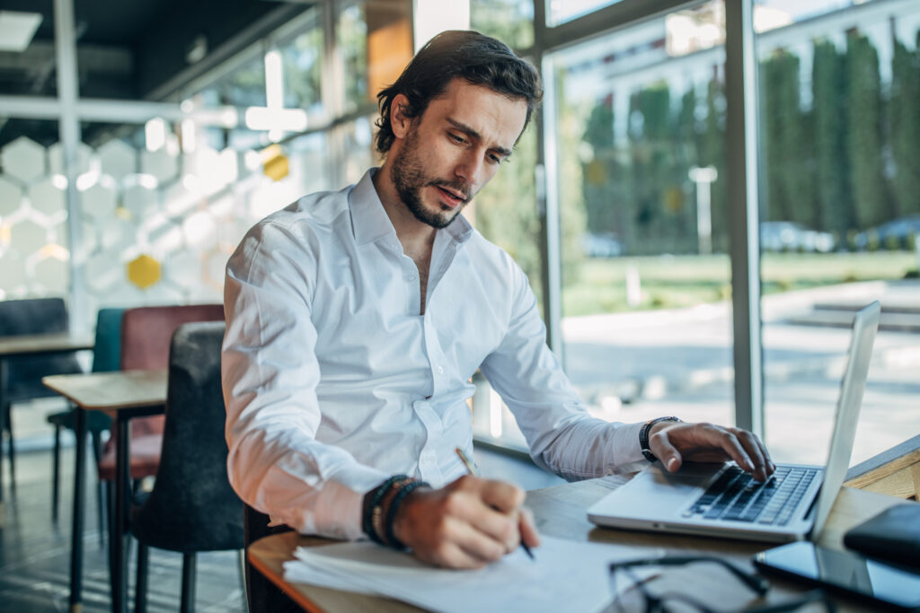 Businessman working in cafe