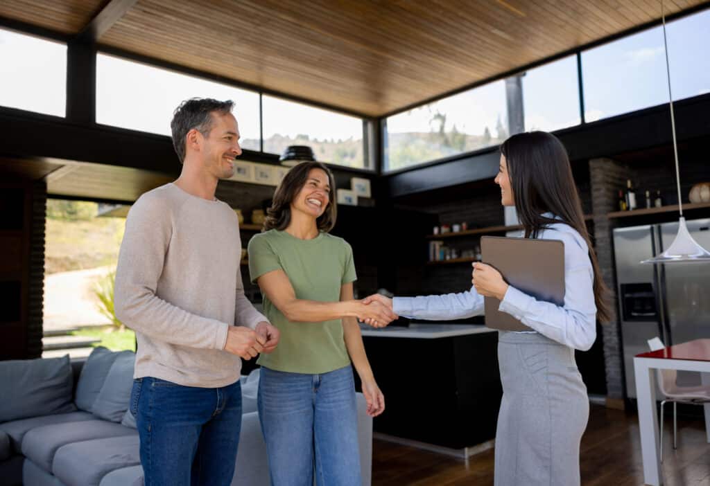 Couple meets with a financial advisor to discuss investment options in New Zealand.