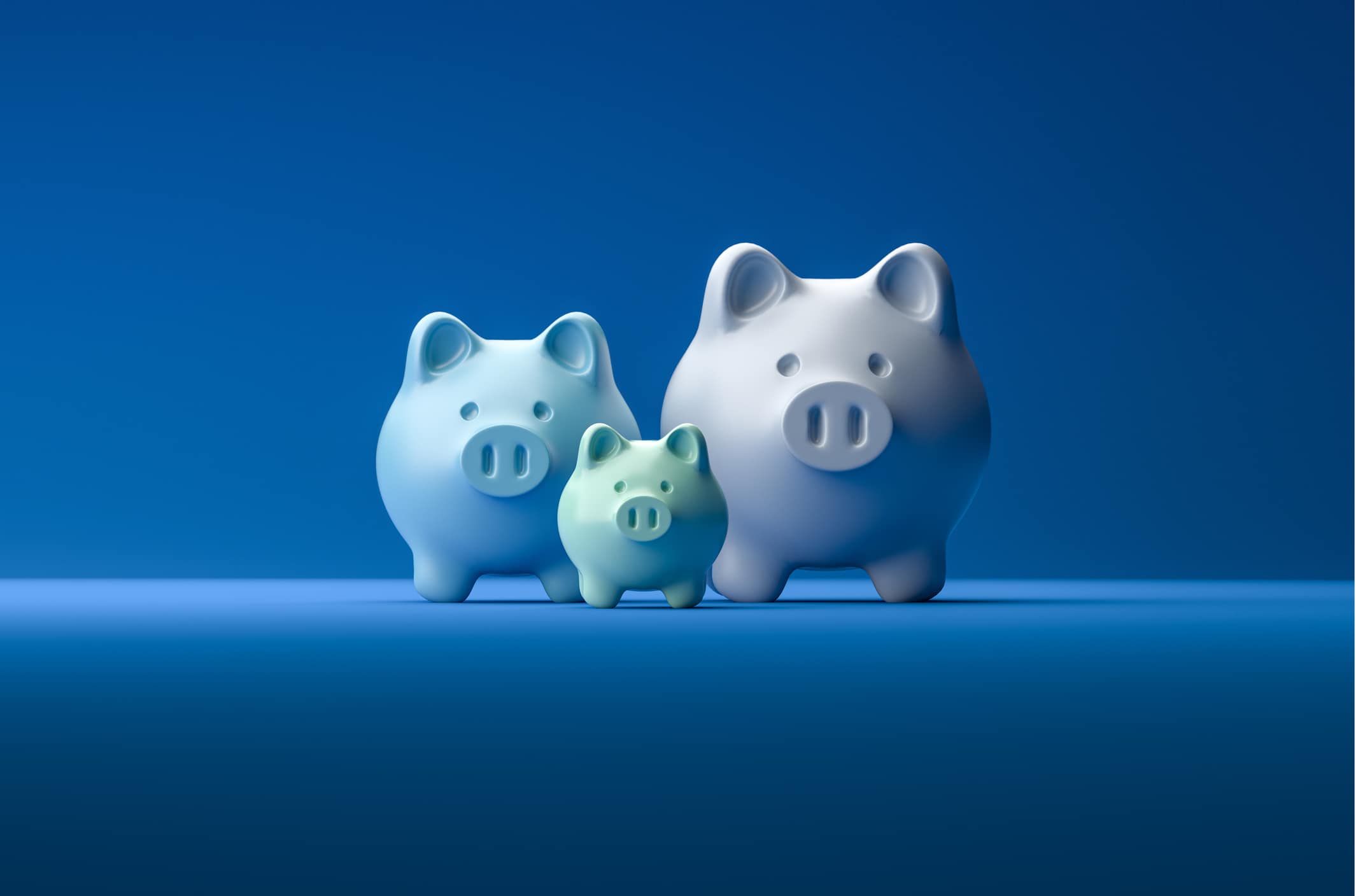 Three piggy banks represent the choice of investing, saving, or opting for KiwiSaver in New Zealand