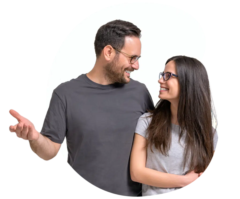 Two smiling people in conversation.